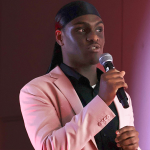 Justin presenting at the Brucey Awards