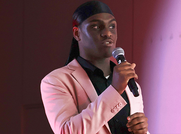 Justin presenting at the Brucey Awards